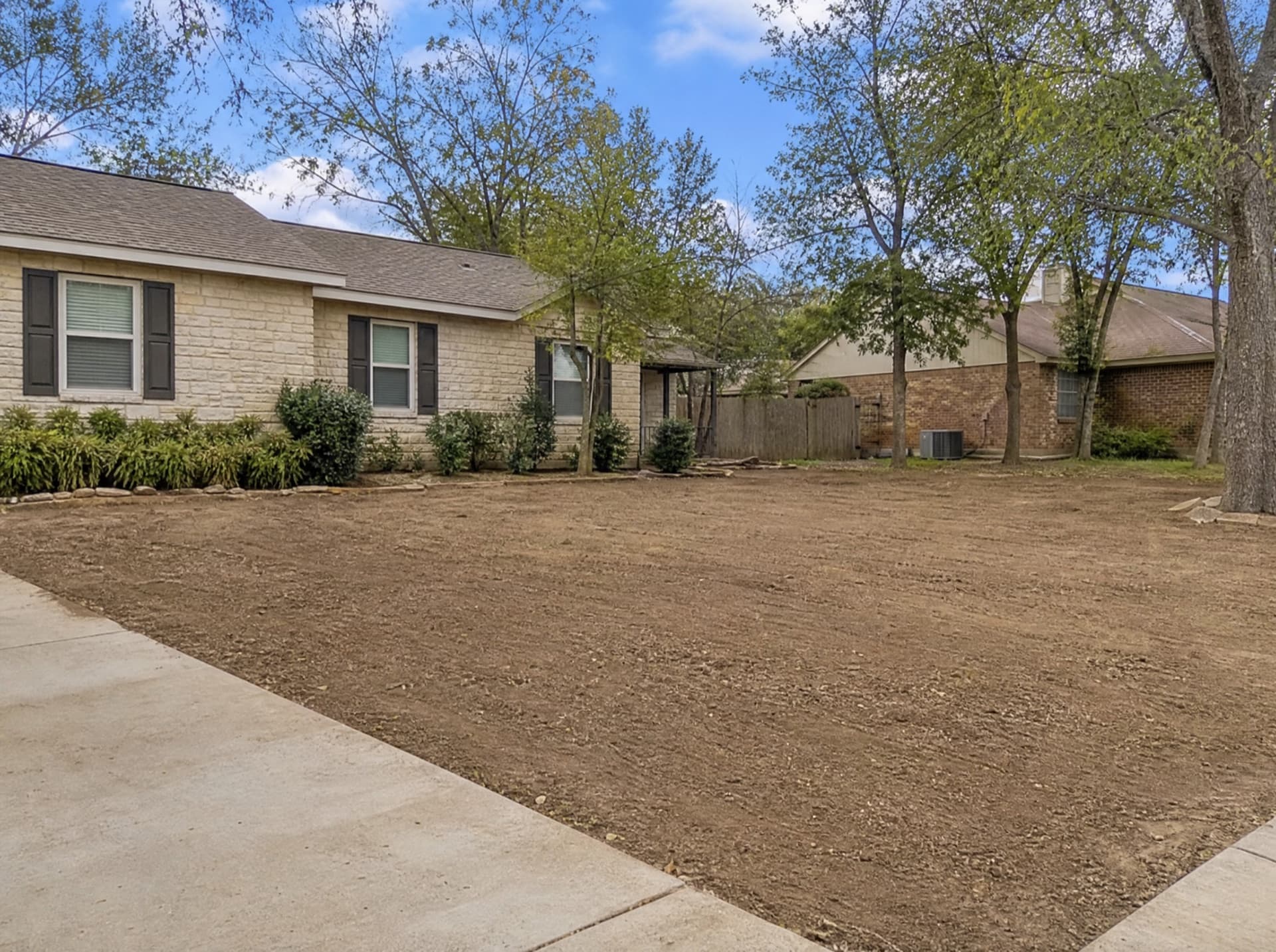 Clean Central Texas front yard after a large tree removal by Raymundo Tree Service in Waco TX